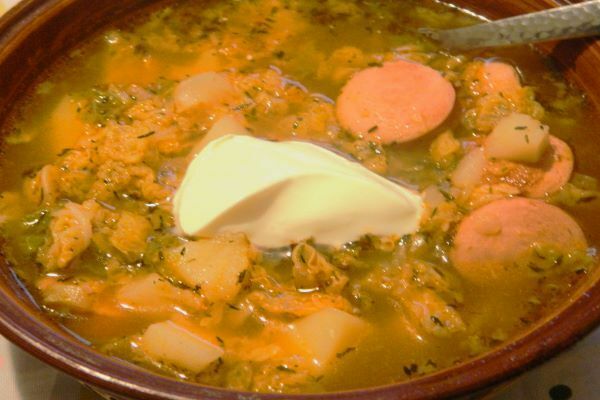 Frankfurter Soup With Savoy Cabbage-Served in Bowl With Sour Cream on Top