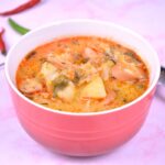 Frankfurter Soup With Savoy Cabbage-Served in Red Bowl With Chilly Peppers