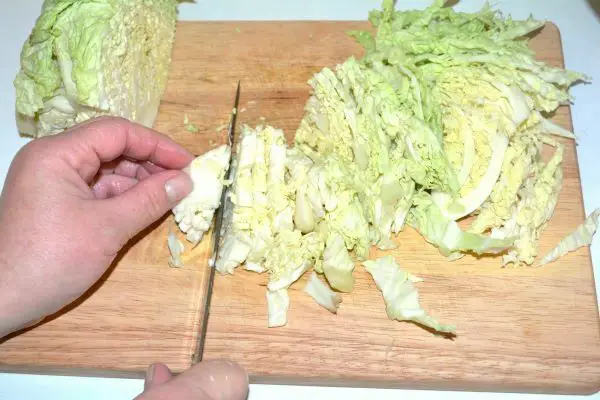Frankfurter Soup With Savoy Cabbage-Slicing the Cabbage on the Chopping Board