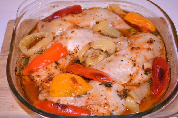 Roasted Chicken Legs in the Oven-Half Cooked Chicken Legs in the Glass Casserole Dish