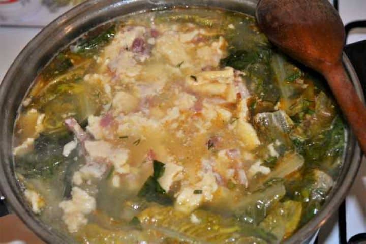 Romaine Lettuce Soup Recipe-Add the Fried Eggs and Chopped Bacon in the Pot Add the Fried Eggs and Chopped Bacon Over the Lettuce Soup in the Pot