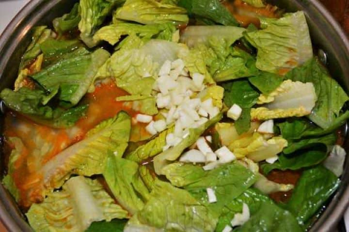 Romaine Lettuce Soup Recipe-Chopped Garlic in the Pot Over the Lettuce Chopped Garlic in the Pot Over the Lettuce