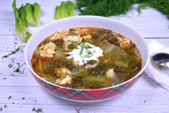 Serve Transylvanian Lettuce Soup Served in the Bowl With Sour Cream on Top