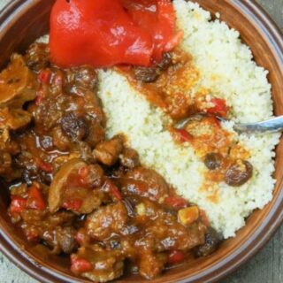 The world best lamb stew with raisins served with couscous and pickled sweet pepper