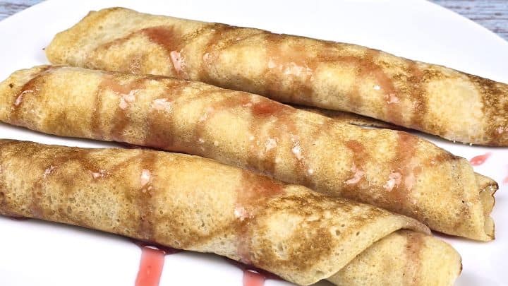 Three Cottage Cheese Filled Crepes Served on Plate