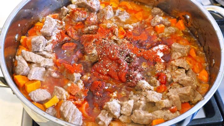 Best Homemade Beef Stew Recipe-Seasoning the Beef Stew With Paprika Powder, Tomatoes Paste and Sweet Pepper Paste Seasoning the Sauteing Meat and Vegetables in the Pan