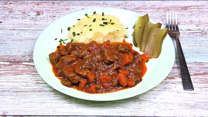 Best Homemade Beef Stew Recipe-Served With Mashed Potatoes Hungarian Beef Stew Served on White Plate With Mashed Potatoes
