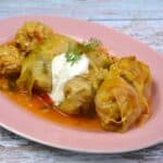 Summer Stuffed Cabbage Rolls Served on Plate With Sour Cream on Top