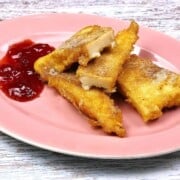 Fried Semolina Pudding Slices Served on Plate With Jam