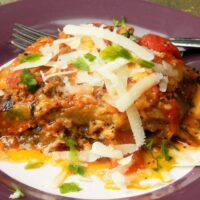 Best Eggplant Casserole Recipe-Served on Plate With Grated Cheddar on Top