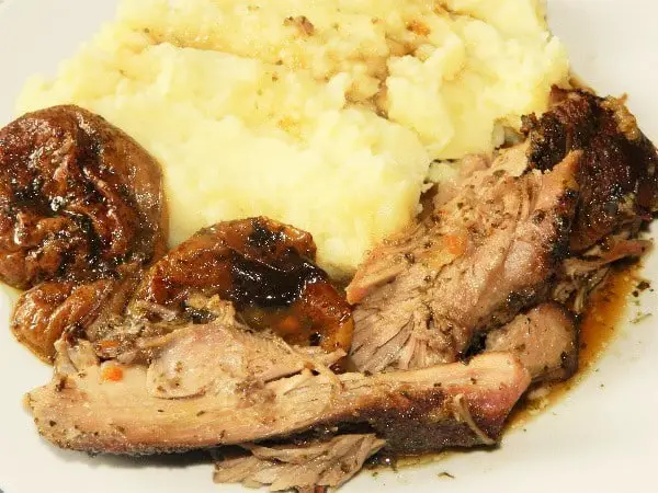 Oven Roasted Turkey Thighs Recipe-Served on Plate With Mashed Potatoes