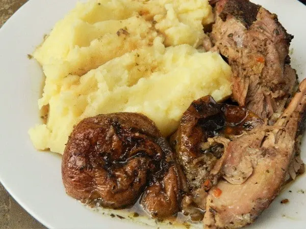 Oven Roasted Turkey Thighs Recipe-Served on Plate With Mashed Potatoes