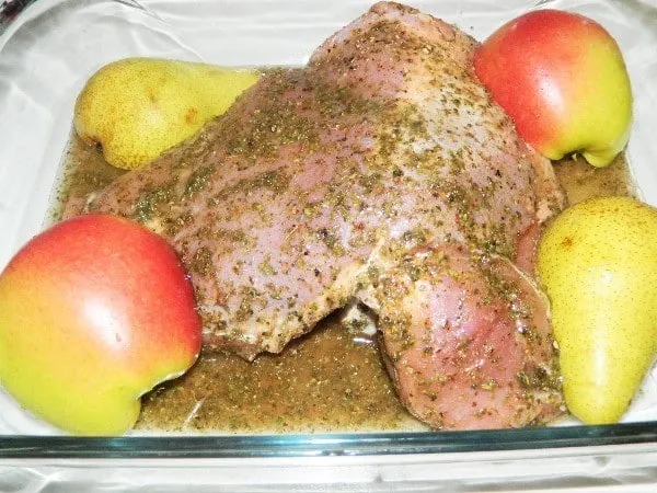 Oven Roasted Turkey Thighs Recipe-Turkey Thigh in Baking Dish With Apples and Pears