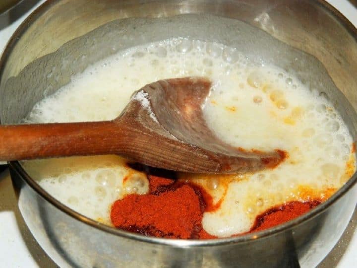 Paprika in the thickening Stirring sweet Hungarian paprika powder into the hot toasted flour roux off the heat source.