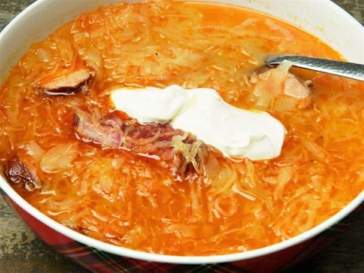 Sauerkraut sausage soup recipe Creamy sauerkraut soup served with a dollop of fresh sour cream, chili peppers, and crusty bread on the side.