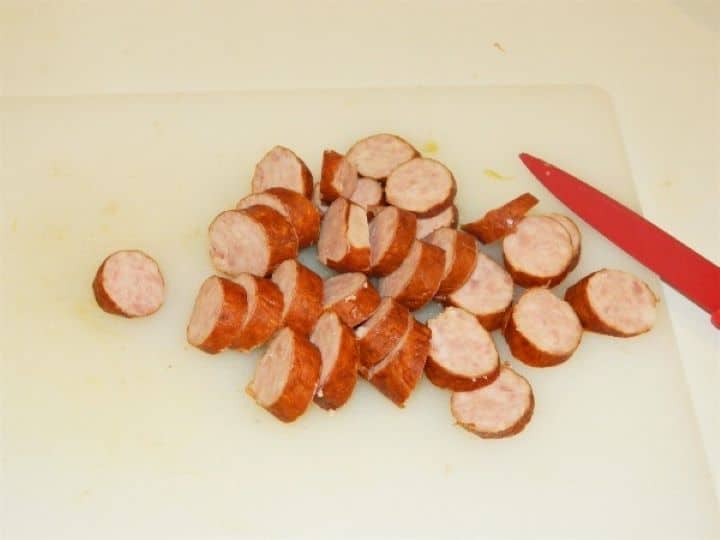 Sliced sausage Smoked pork sausage sliced into medium-thick rounds for the traditional sauerkraut soup recipe.
