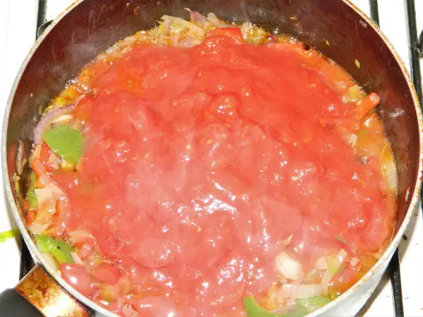 Best Vegetable Stew Recipe-Pour the chopped tomatoes on the stew.