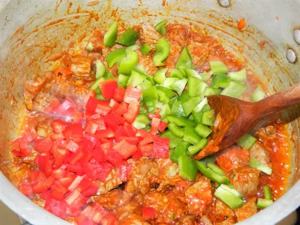 Traditional Hungarian Goulash Recipe-Add the Cut Green and Red Peppers Over the Frying Meat