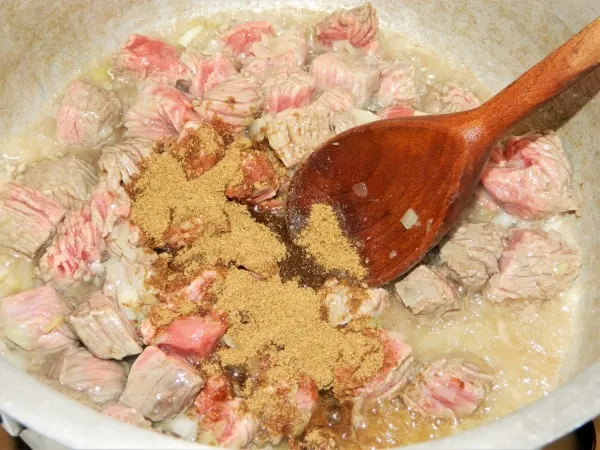 Traditional Hungarian Goulash Recipe-Seasoning the Meat With Salt, Pepper and Caraway