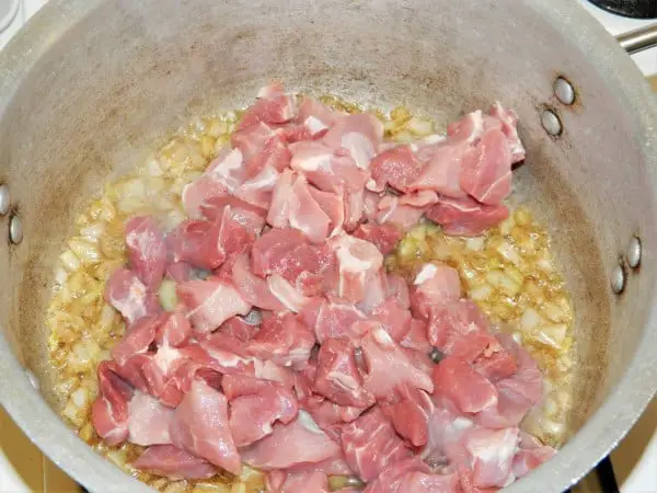 Best Cabbage Soup Recipe-Cut Pork Meat on Frying Onions