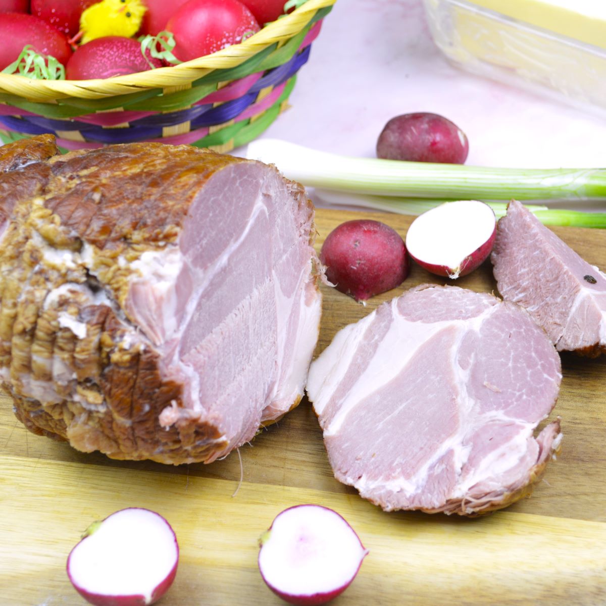 Best Easter Ham Recipe-Sliced Ham Served on Chopping Board With Radish and Spring Onions