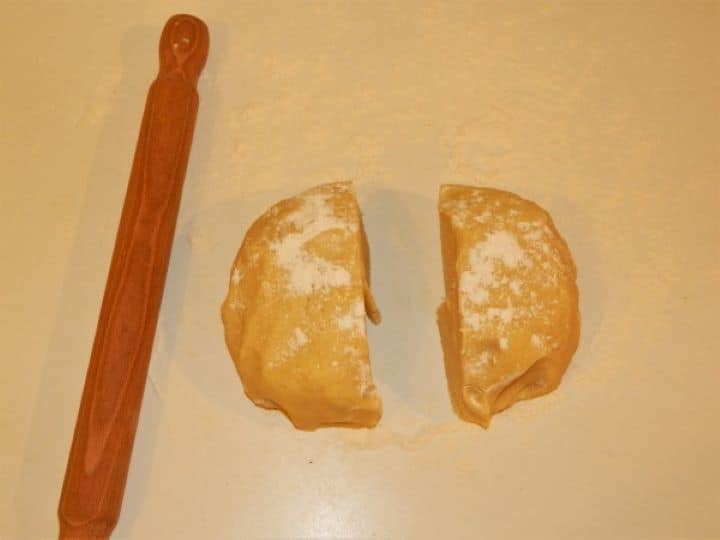 Apple Cake Dough Cut in Two on Working Surface