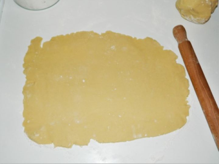 Rolling the First Sheet of Dough on the Working Table