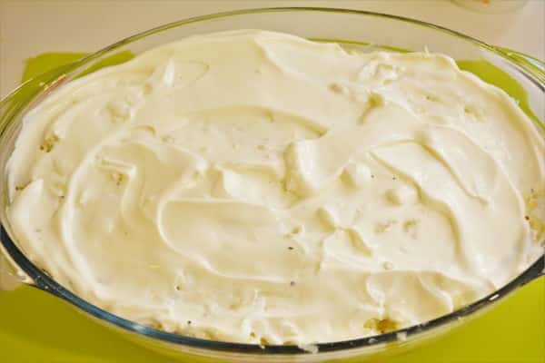 Best Cheesy Potato Casserole Recipe-Pour Sour Cream on the Casserole