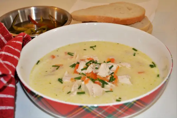 Best Creamy Chicken Soup Recipe-Served in Bowl With Bread and Pickled Chilli