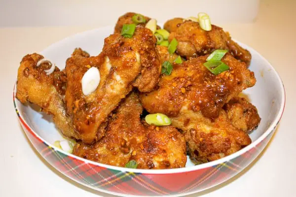 Honey and Garlic Chicken Wings Recipe-Served in Bowl With Chopped Spring Onions