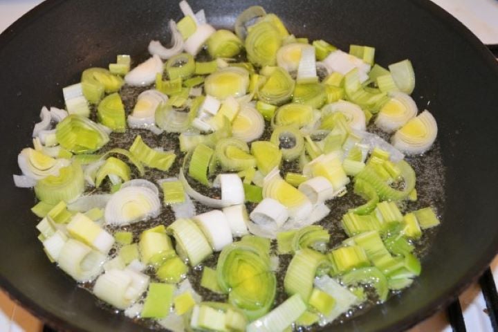 Best Cheesy Potato Casserole Recipe-Frying Chopped Leaks Frying Chopped Leek in the Pan