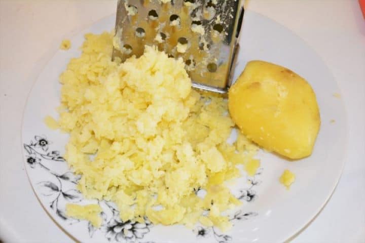 Best Cheesy Potato Casserole Recipe-Grated Boiled Potatoes Grated Boiled Potatoes on the Plate