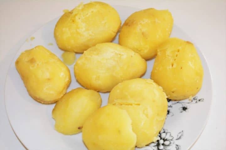 Best Cheesy Potato Casserole Recipe-Peeled Boiled Potatoes Peeled Boiled Potatoes on the Plate
