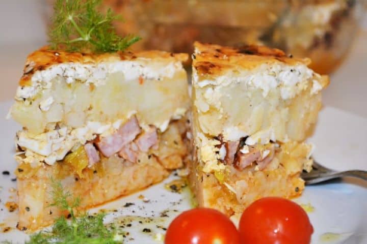 Best Cheesy Potato Casserole Recipe-Served on Plate With Cherry Tomatoes Hungarian Rakott Krumpli Served on Plate With Cherry Tomatoes