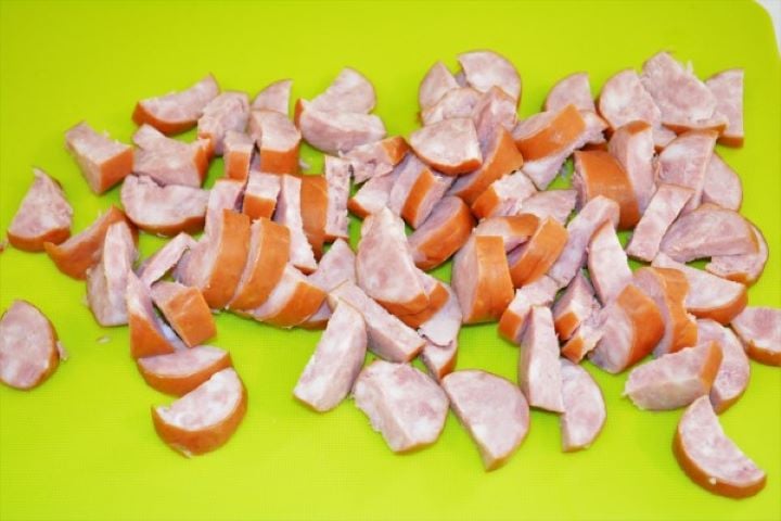 Best Cheesy Potato Casserole Recipe-Sliced Sausage Sliced Smoked Sausage on the Chopping Board