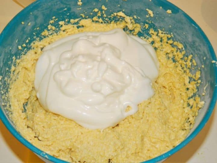 Adding whipped egg whites to the sweet cornmeal batter.