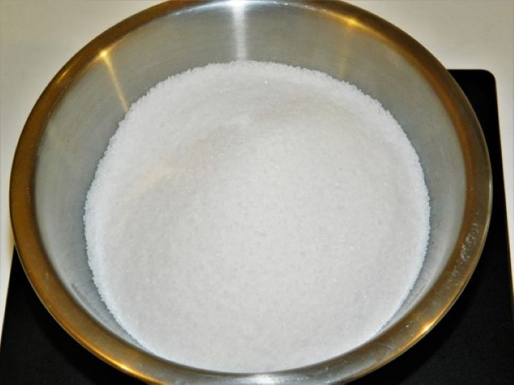 White caster sugar measured in a small bowl.