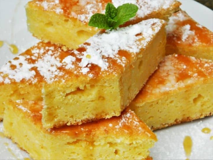 Sweet cornmeal cake slice drizzled with warm honey.