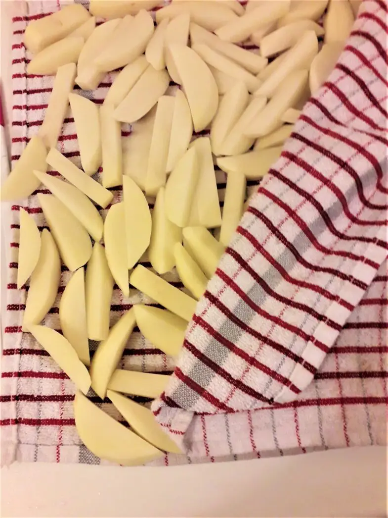French Fries-Wiped Potatoes in the KItchen Towel