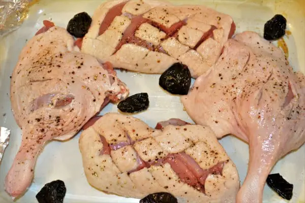 Best Braised Duck Legs Recipe-Seasoned Duck Legs and Breasts With Dried Plums in Baking Tray