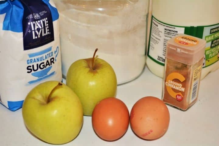 Easy Cinnamon Apple Pancakes Recipe-Ingredients Easy Cinnamon Apple Pancakes Ingredients Like Flour, Sugar, Milk, Eggs, and Apples on the Table