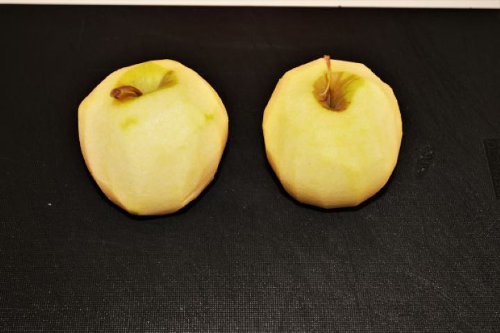 Easy Cinnamon Apple Pancakes Recipe-Peeled Apples Two Peeled Apples on a Cutting Board
