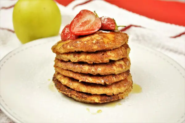 Easy Cinnamon Apple Pancakes Recipe-Served on Plate With Maple Syrup and Strawberry