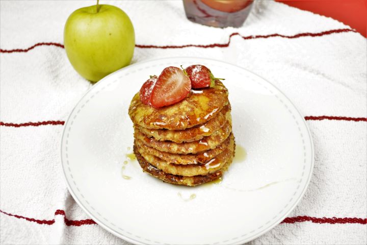 Easy Cinnamon Apple Pancakes Served on Plate With Maple Syrup and Strawberries