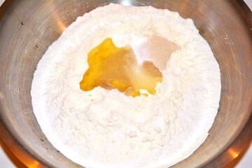 Adding sunflower oil to flour and instant yeast for Hungarian Langos dough
