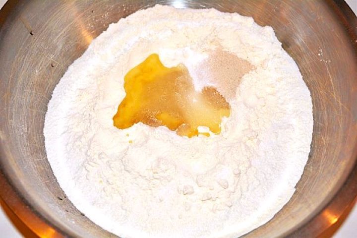 Homemade Fried Dough Recipe-Plain Flour, Yeast, Sea Salt, Sugar and Sunflower Oil Plain Flour, Yeast, Sea Salt and Sunflower Oil in a Bowl
