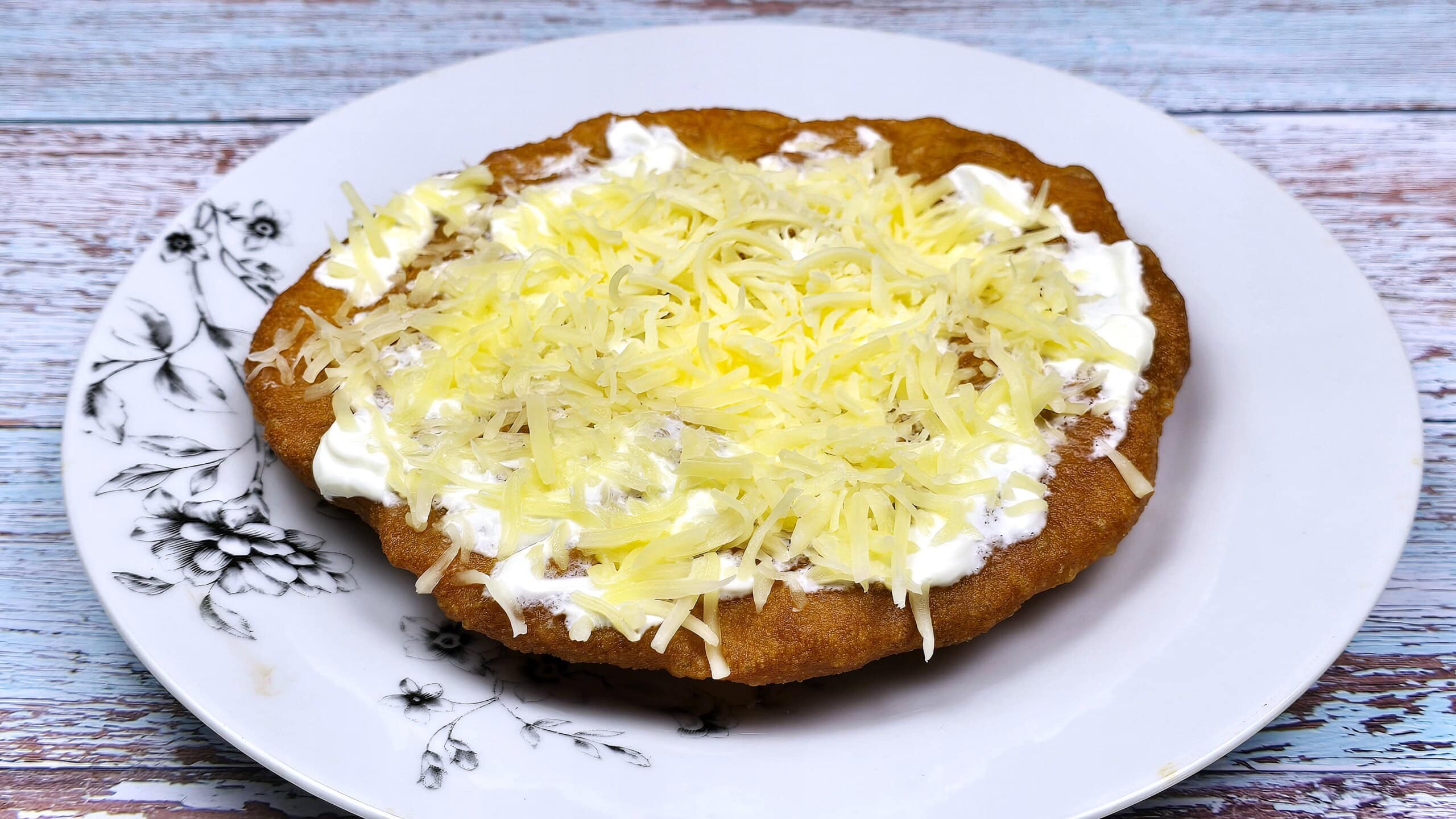 Homemade Fried Dough Recipe-Served With Sour Cream and Grated Cheese Authentic Hungarian Lángos Served With Sour Cream and Grated Cheese