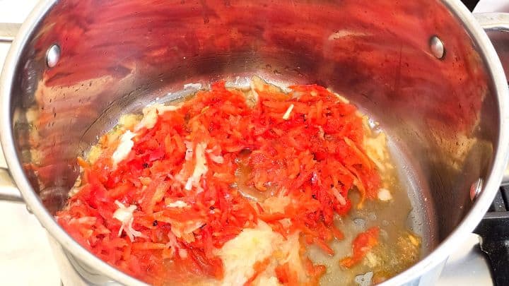 Frying Grated Onion and Red Pepper in the Pot