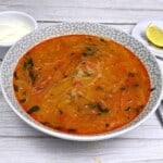 Creamy Kohlrabi Soup Served in Bowl With Sour Cream and Lemon