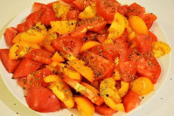 Tomatoes Caprese Salad Recipe-Seasoned Red and Yellow Tomatoes on the Plate